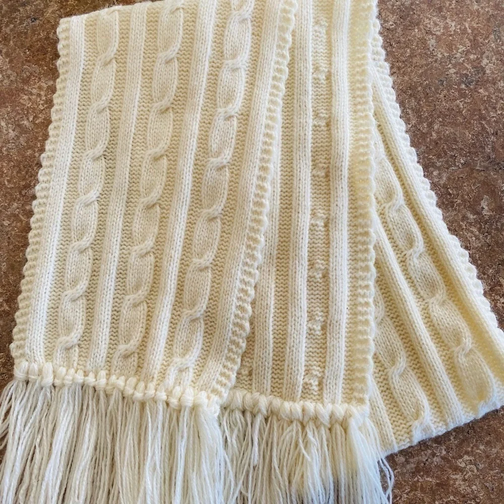 Cable knit winter white scarf. 59”L without fringe 7”W Look gorgeous and warm. C